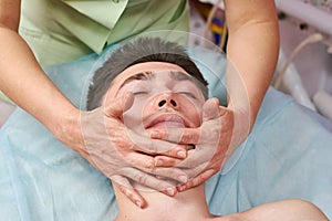 Man getting face massaged.