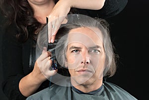 Man Getting Long Hair Cut Off For Cancer Fundraiser photo