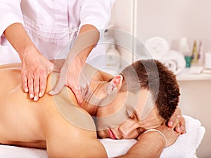 Man getting massage in spa.