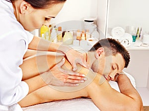 Man getting massage in spa.