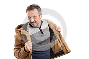 Man getting ready for cold weather with jacket