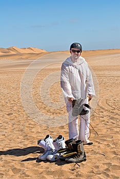Man getting ready to sandboard