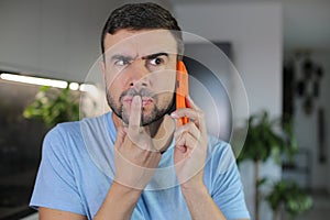 Man getting a suspicious phone call