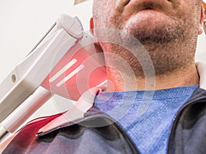 Man getting UV heat treatment at clinic photo