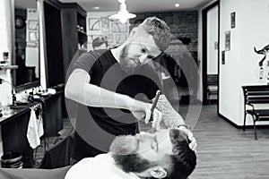 Man getting trendy haircut at barber shop.