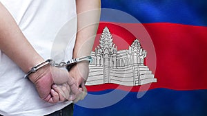 A man getting under arrest in Cambodia. Concept of being handcuffed, detained, incarcerated and jailed in said country. National