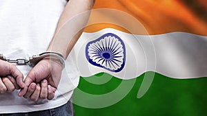 A man getting under arrest in India. Concept of being handcuffed, detained, incarcerated and jailed in said country. National law