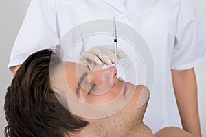 Man Getting Wrinkle Treatment From Doctor