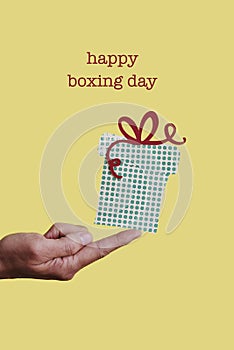 Man with a gift and text happy boxing day