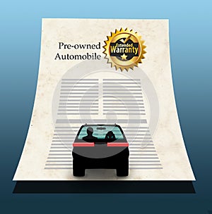A man and girl in a car drive up onto a huge extended warranty agreement document for pre-owned automobiles