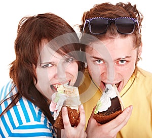 Man and girl eating cake.