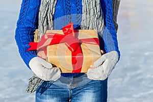 Man and girl hug in the back with gift in their hands