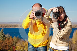 Man and girl photographed in nature.