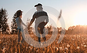 Man and a girl are walking in the autumn