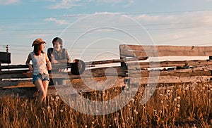 Man and a girl are walking in the autumn