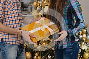 Man Give Present Gift Box Woman Christmas Holiday Happy Couple Near Decorated Pine Tree