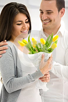 Man gives his girlfriend a flowers