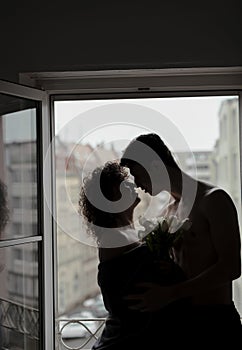 Man giving a bouquet of tulips to his woman