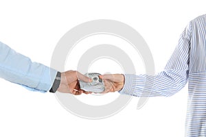 Man giving bribe money to woman on background, closeup of hands