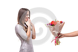 Man giving a bunch of flowers and surprised woman isolated photo