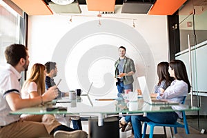 Man giving a business presentation to his colleagues