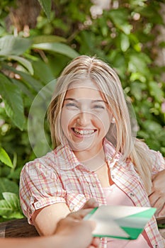 Man giving a card to his girlfriend photo