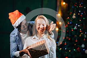 Man giving Christmas present to his girlfriend