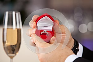 Man giving engagement box with ring.