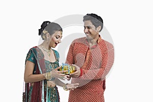 Man giving gift to his wife on Diwali