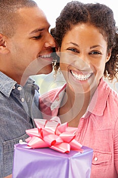 Man giving gift to woman