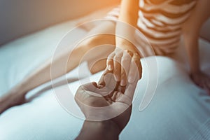 Man giving hand to depressed woman,Psychiatrist holding hands patient,Mental health care concept