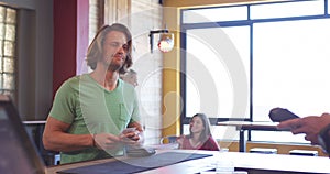 Man giving his credit card to a bartender.