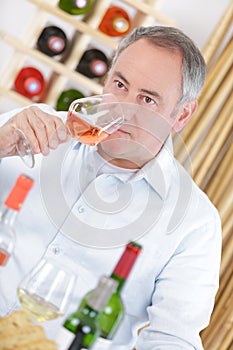 Man giving mark to wine