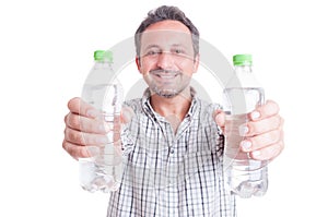 Man giving or offering two bottles of cold water