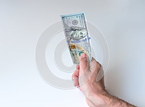 Man giving one hundred US Dollars