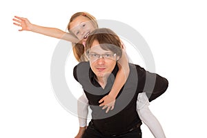 Man giving piggyback ride to a little girl