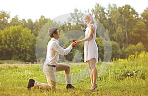 Man giving a ring woman, love, couple, date, wedding - concept