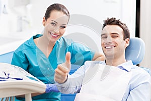 Man giving thumbs up at dentist office