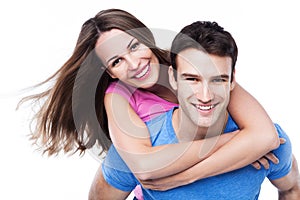 Man giving woman piggyback ride