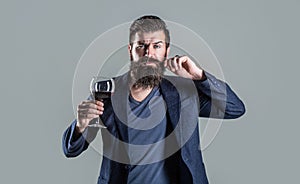 Man with a glass of red wine in his hands. Beard man, bearded, sommelier tasting red wine. Sommelier, degustator with