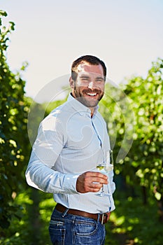 Man with a glass of white wine