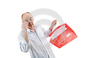 Man in glasses hold red paperbag photo