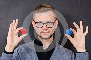 A man with glasses offers to choose one of the options