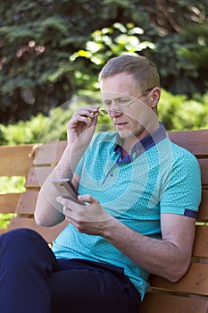 Man in glasses with phone