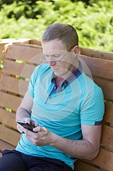 Man in glasses with phone