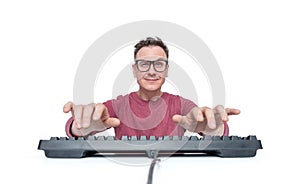 Man in glasses and a red T-shirt is typing on the keyboard, a look into the camera, isolated on white background. Front view.