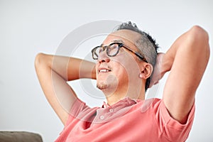 Man in glasses relaxing or dreaming at home