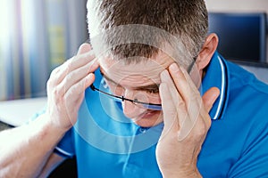 The man with glasses suffers from depression . Problems in personal life and at work. Stress and depression. Migraine is a