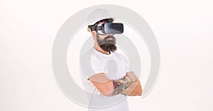 The man with glasses of virtual reality. Cheerful smiling man looking in VR glasses. Young man using a virtual reality
