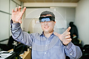 Man with glasses of virtual reality gesturing